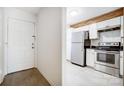 Modern kitchen with stainless steel appliances and white cabinets at 6102 Heath Ridge Ct # G, Charlotte, NC 28210