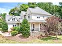 Well-maintained two-story home featuring stone accents, a cozy covered porch, and a beautifully landscaped yard at 9267 Egret Rdg # 41, Belmont, NC 28012