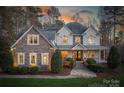 Elegant two-story home with warm lighting at dusk at 9267 Egret Rdg # 41, Belmont, NC 28012