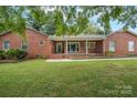 Brick ranch house with a large yard at 102 Goodman Ne Cir, Concord, NC 28025