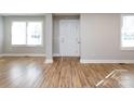 Bright entryway with hardwood floors and neutral walls at 406 Harris Ln, Monroe, NC 28112