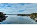 Scenic lakefront view with clear water and lush trees at 110 Fern Haven Ln, Mooresville, NC 28117
