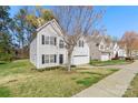 Attractive two-story home featuring a well-maintained lawn, attached garage, and classic architectural details at 3015 Hendricks Chapel Ln, Charlotte, NC 28216