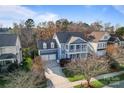 Aerial view of a two-story home with double porches, garage, and well-maintained landscaping at 428 Vintage Hill Ln, Huntersville, NC 28078