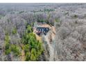 Secluded home nestled in the woods, showcasing privacy and natural surroundings at 6610 Rolling Ridge Dr, Waxhaw, NC 28173