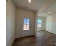 Light and airy entryway with wood-look flooring, leading to a living area at 168 Salem Springs Ln, Statesville, NC 28625