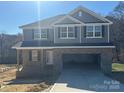 Two-story home featuring a spacious driveway and an attached garage at 200 Fostoria Pl # 78A, Albemarle, NC 28001