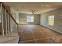 Bright living room with large windows and a ceiling fan at 200 Fostoria Pl # 78A, Albemarle, NC 28001