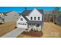 Inviting two-story home with a well-kept lawn and a two-car garage, perfect for a growing Gathering at 2234 Millennium Dr # 84, Lancaster, SC 29720