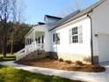 White house with gray roof, brick base, and front porch at 2270 Charlotte Hwy, York, SC 29745