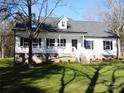 Two-story white house with a gray roof, and a front porch at 2270 Charlotte Hwy, York, SC 29745