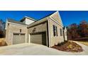 Spacious three-car garage, set in brick with an inviting driveway at 3850 Willow Grove Ln # 24, Concord, NC 28025