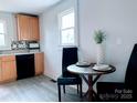 Bright eat-in kitchen with new appliances and modern decor at 606 Carver St, Kannapolis, NC 28083