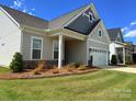 Attractive single-Gathering home with manicured lawn, stone accents, and a welcoming covered entry at 405 Northgate Blvd, Indian Trail, NC 28079