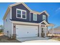 Two-story home featuring a two-car garage, charming architectural details, and neutral color scheme at 1333 Morehead Dr, Salisbury, NC 28144