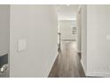 Inviting hallway with hardwood floors that leads to an open living space with lots of natural light at 1333 Morehead Dr, Salisbury, NC 28144