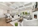 Spacious living room with coffered ceilings, fireplace, and sliding glass doors leading to the outdoors at 267 Triple Ponds Ct # 11, Clover, SC 29710