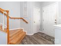 Bright entryway features hardwood stairs, modern flooring, and neutral paint, creating a welcoming space at 3000 Misty Harbor Cir # F, Cramerton, NC 28032