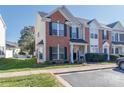 Charming townhome features a brick facade, complemented by a lush lawn and welcoming curb appeal at 3000 Misty Harbor Cir # F, Cramerton, NC 28032