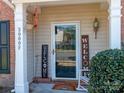 Inviting front porch featuring charming decor, a rocking chair, and a welcoming atmosphere at 3000 Misty Harbor Cir # F, Cramerton, NC 28032