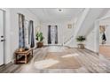 Bright and airy living room featuring hardwood floors and a staircase at 610 4Th St, Spencer, NC 28159