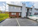 Exterior view of well-maintained condominium complex with parking and manicured landscaping at 123 23Rd Nw St # E, Hickory, NC 28601