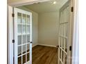 Inviting office space with glass French doors and wood flooring providing privacy and style to the workspace at 2615 Tillman St, Monroe, NC 28112