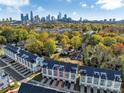 Stunning aerial view showcasing the townhome community and Charlotte skyline in the background at 582 West End Dr, Charlotte, NC 28208