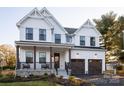 Elegant two-story home boasting white siding, a stone foundation, a cozy porch, and a convenient two-car garage at Lot 51 Watercourse Way # Covington, Belmont, NC 28012
