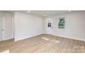 Bright and airy living room with hardwood floors and recessed lighting at 429 Dare Dr, Charlotte, NC 28206