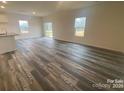Bright living room with hardwood floors and plenty of natural light at 104 Salem Springs Ln, Statesville, NC 28625