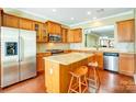 Spacious kitchen with granite countertops, wood cabinets, and stainless steel appliances at 2221 Hartwell Ln, Fort Mill, SC 29707