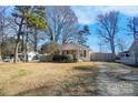 Charming bungalow with spacious yard and surrounding homes at 128 Hugh Caldwell Rd, Charlotte, NC 28214