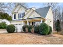 Well-maintained two-story home with neutral siding and a manicured front lawn at 141 Byers Rd, Troutman, NC 28166