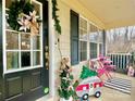 Inviting front porch decorated for the holidays at 141 Byers Rd, Troutman, NC 28166