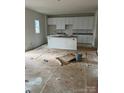 Unfinished kitchen with white cabinets and granite countertops at 164 Wildwood Loop, Statesville, NC 28677