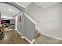 Entry hallway with staircase, showcasing the transition between floors and access to living areas at 2117 Talbert Ct, Charlotte, NC 28214