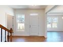 Inviting foyer with natural light, hardwood flooring, and a view of the home's exterior at 251 Winford Rd, Troutman, NC 28116