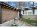 Brick home's front entrance with steps and landscaping at 352 Leafmore Dr, Charlotte, NC 28213