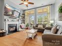Spacious living room with fireplace, hardwood floors, and large windows at 1419 Imperial Court Imperial Ct, York, SC 29745