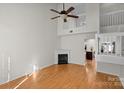 Living room with hardwood floors and a fireplace at 14922 Deshler Ct, Charlotte, NC 28273