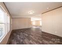 Open-concept living area with wood flooring with a view of the deck outside at 3357 34Th Avenue Ne Ct, Hickory, NC 28601