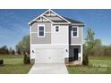 Two-story house with gray siding, white garage door, and landscaping at 1204 31St St, Conover, NC 28613