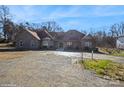 Brick house with a large driveway and mature trees at 1808 Wilton Gate Dr, Charlotte, NC 28262