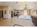 Open living room with tile floors and a view of the kitchen at 1808 Wilton Gate Dr, Charlotte, NC 28262