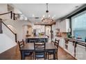 Open-concept kitchen with a large island, stainless steel appliances, and adjacent dining area at 6012 Drave Ln, Fort Mill, SC 29715