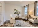 Bright office space with wood desk, two armchairs, and large art piece at 4064 Skyboat Cir, Fort Mill, SC 29715