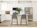 Modern kitchen with white cabinets and island at 4068 Skyboat Cir, Fort Mill, SC 29715