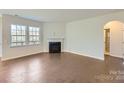 Bright living room with fireplace and hardwood floors at 123 Dogwood Grove Pl, Troutman, NC 28166