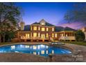 Inviting in-ground pool with spa and spacious deck at 1511 Churchill Downs Dr, Waxhaw, NC 28173